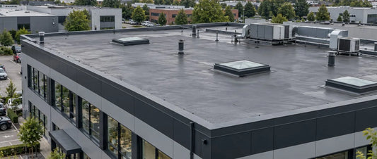 GRP or EPDM flat roofing on a large commercial building rooftop