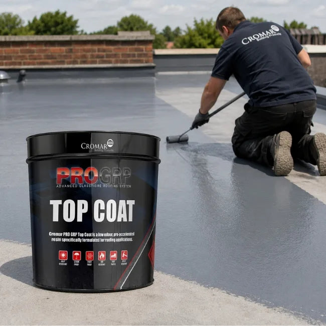 Cromar PRO GRP Top Coat on grey flat roof surface with roller showing smooth waterproof roof finish