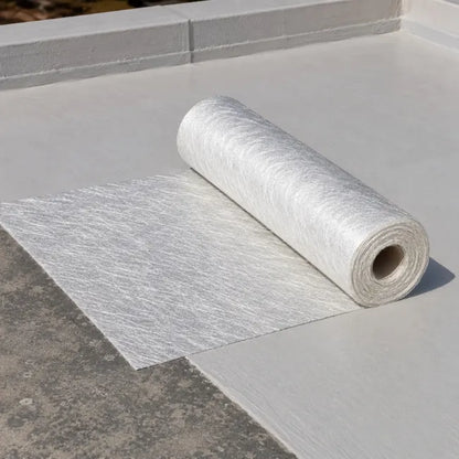 Fibreglass chopped strand matting rolled out on flat roof for resin lamination and reinforcement